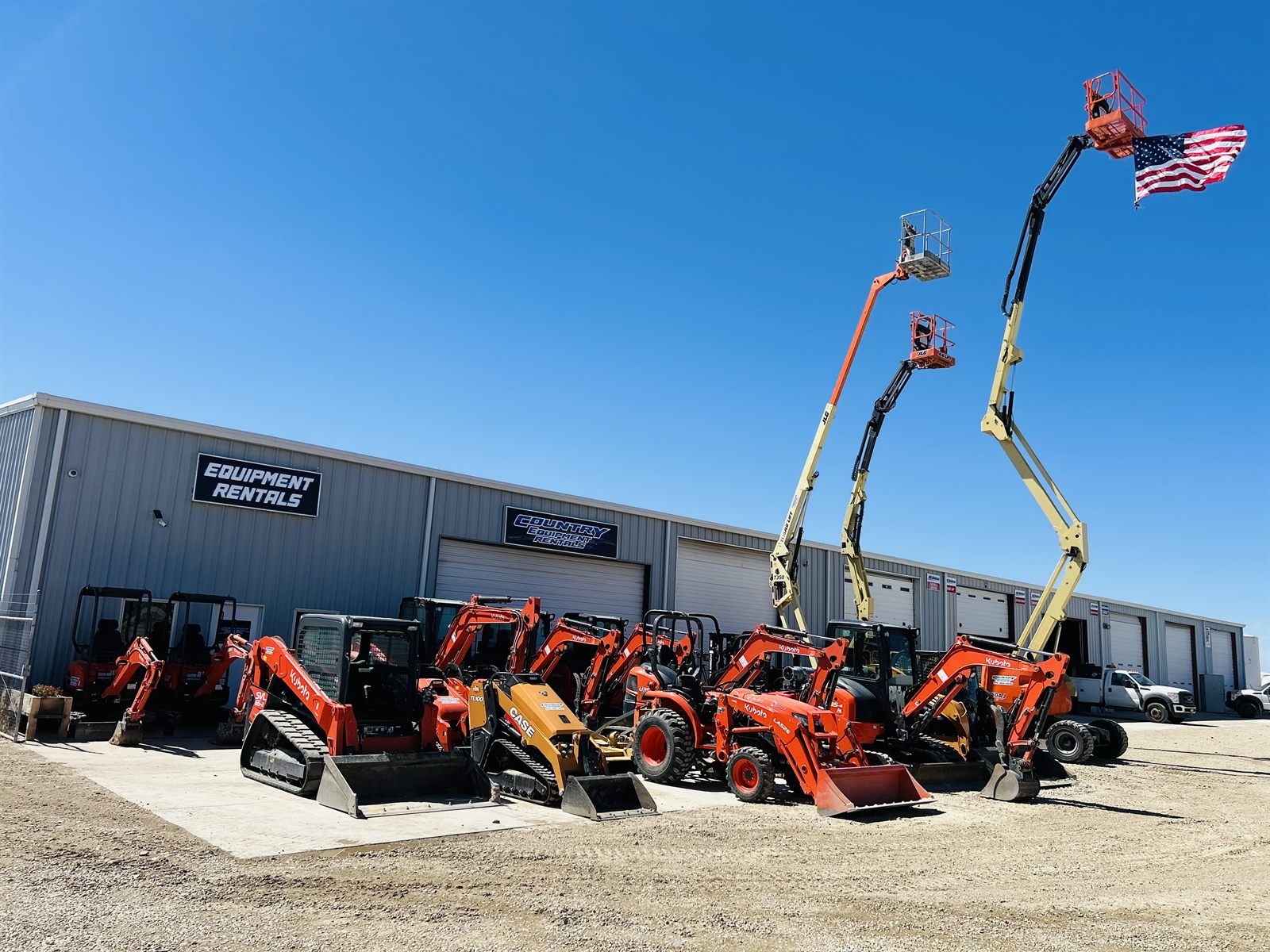 The Country Equipment Rentals fleet at the Nampa, Idaho yard — excavators, skid steers, lifts and trailers